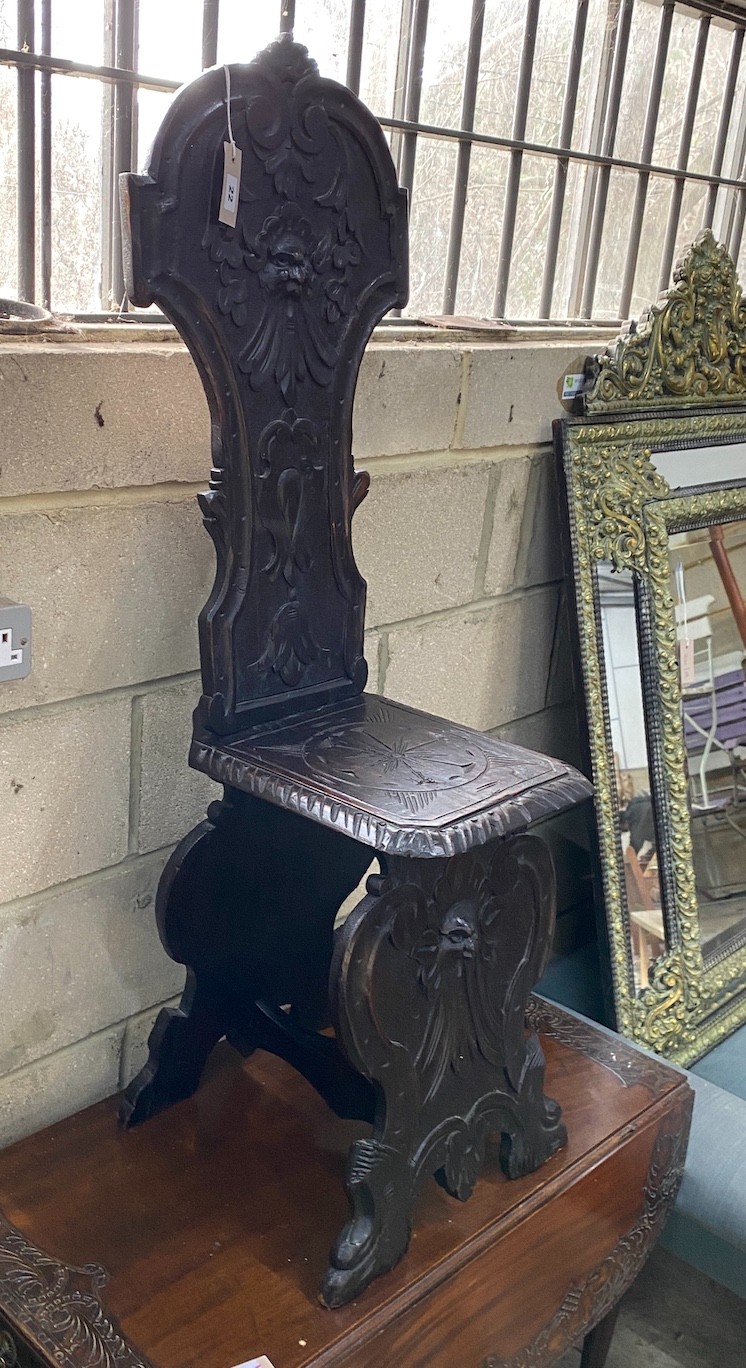 A late Victorian carved fruitwood hall chair, height 118cm